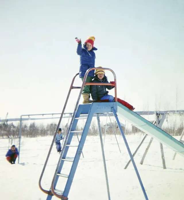 Framed Print : Ojibway community of Webequie First Nation, Eastwood Island, Northern Ontario, Canada 1978 Children playing on a slide at a playground