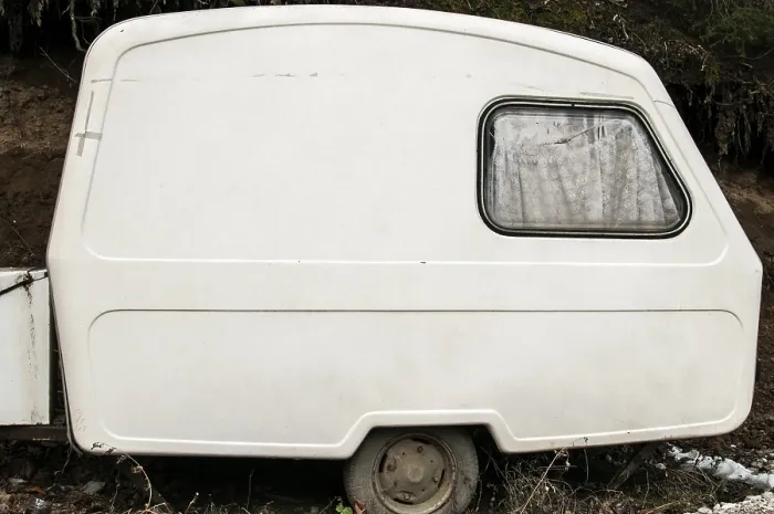 Framed Print : Old abandoned weathered small white vintage caravan