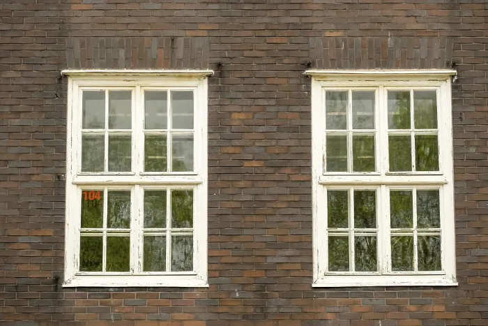 Framed Print : Old brick building with old double windows