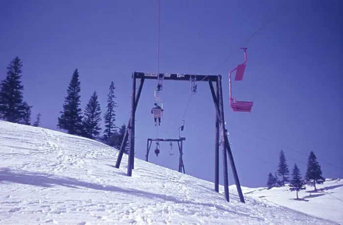 Framed Print : Old chairlift in the snow, with a ski slope underneath