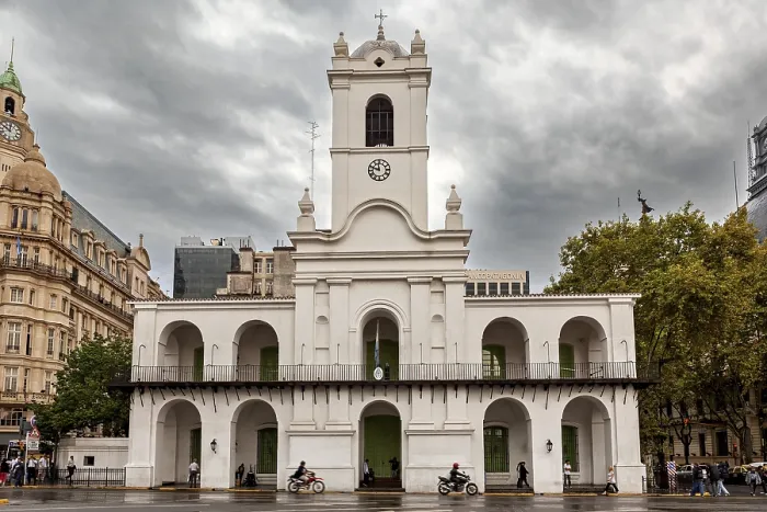 Framed Print : An old colonial style building with clock tower under a cloudy sky in the city