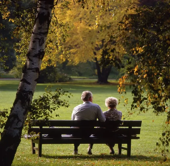 Framed Print : Old couple on the park bench autumn mood