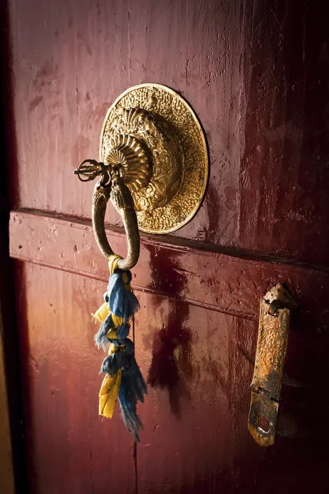 Framed Print : Old door at Buddhist monastery temple decorated with ancient doorknob and tassel