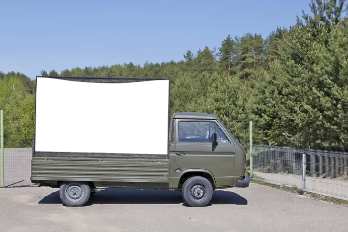 Framed Print : An old no name green army truck with a empty billboard set in a pine forest