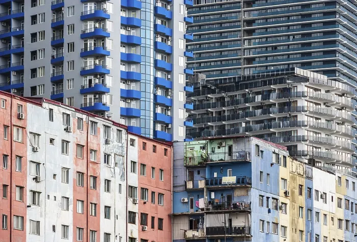 Framed Print : Old high-rise building behind it modern high-rise buildings Framed Print : Old high-rise building behind it modern high-rise buildings