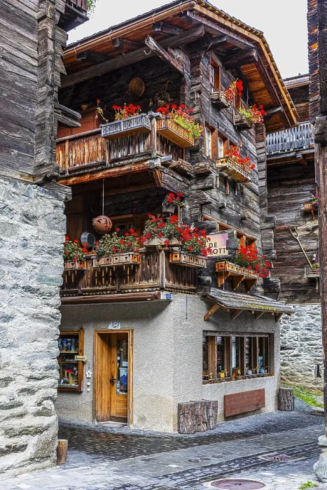 Framed Print : Old house decorated with flowers in the historic village centre