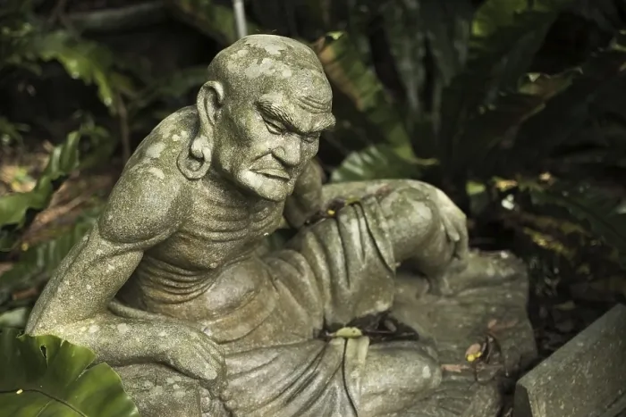 Framed Print : Old ruined Arhat Kanakbharadvaja statue in forest