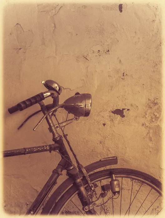 Framed Print : Old rusty vintage bicycle leaning against a wall in a countryside
