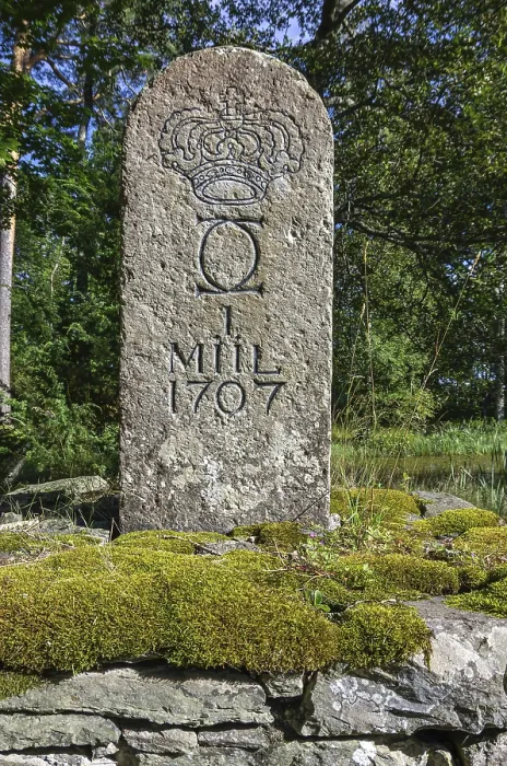 Framed Print : Old Swedish milestone from 1707 by the wayside in a grove in front of Lacko Castle by Lake Vanern Framed Print : Old Swedish milestone from 1707 by the wayside in a grove in front of Lacko Castle by Lake Vanern