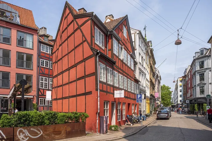 Framed Print : Old town street with historic, red half-timbered houses in a row