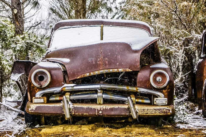 Framed Print : Old vintage plymouth automobile in the woods covered in snow Framed Print : Old vintage plymouth automobile in the woods covered in snow