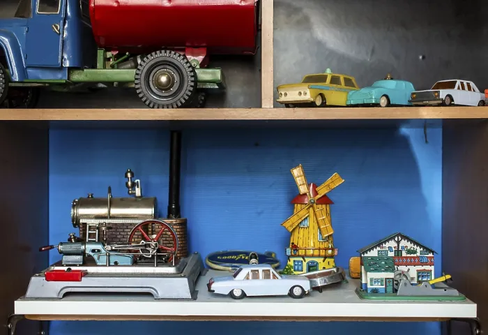 Framed Print : Old vintage toys on shelf. Collection of vintage cars toys in a shop Framed Print : Old vintage toys on shelf. Collection of vintage cars toys in a shop
