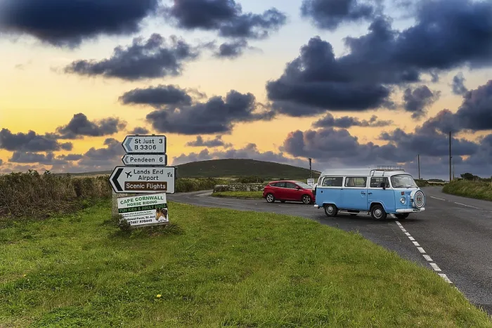 Framed Print : Old VW bus, vintage car, next to direction signs to St Just Framed Print : Old VW bus, vintage car, next to direction signs to St Just