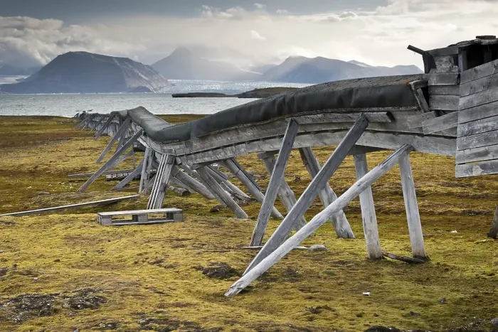 Framed Print : Old water pipeline, on stilts above ground because of the permafrost