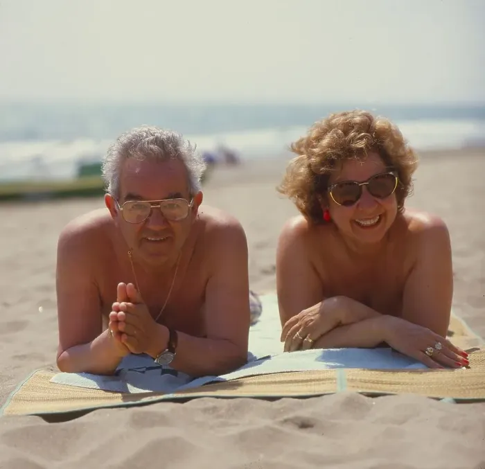 Framed Print : Older married couple on the beach