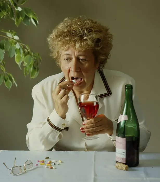 Framed Print : Older woman with wine glass and bottle Framed Print : Older woman with wine glass and bottle
