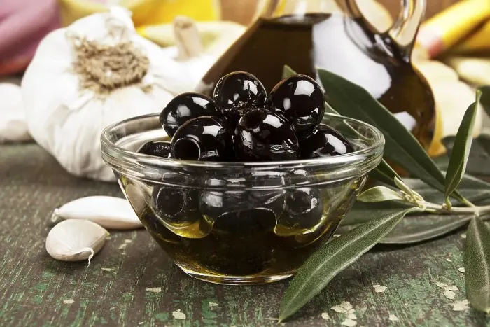 Framed Print : Olives with garlic and a bottle of olive oil Framed Print : Olives with garlic and a bottle of olive oil