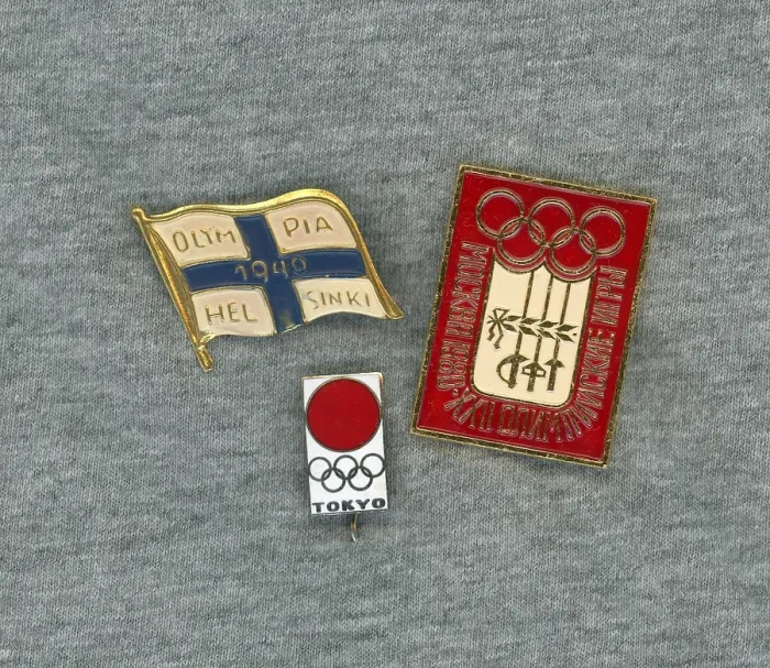 Framed Print : Olympic pins. Three pins from different olympic games