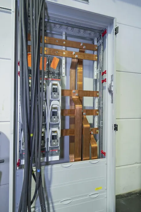 Framed Print : Open cable cabinet with visible copper rods and power cables