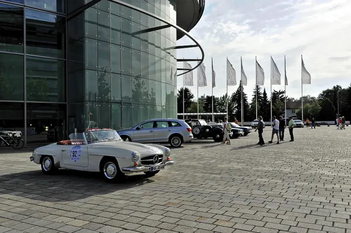 Framed Print : Open space in front of a modern building with a parked vintage car Framed Print : Open space in front of a modern building with a parked vintage car