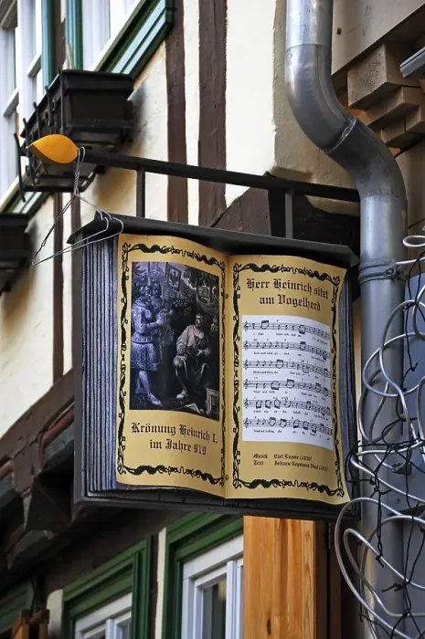 Framed Print : Opened, old songbook as advertising sign of a bookshop Framed Print : Opened, old songbook as advertising sign of a bookshop