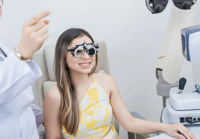 Framed Print : Optometry eye health concept. Optometrist assisting patient with optometrist trial frame