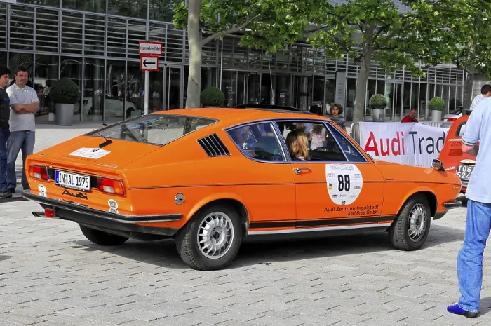 Framed Print : Orange Audi classic car on an urban street at an event