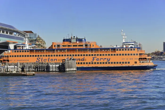 Framed Print : An orange-coloured Staten Island Ferry ship in the harbour