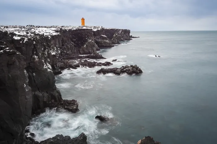 Framed Print : Orange lighthouse Ondverdarnes stands on a dark cliff Framed Print : Orange lighthouse Ondverdarnes stands on a dark cliff