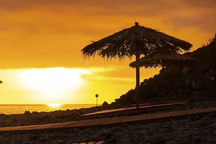 Framed Print : Orange sunset on the umbrellas at Ponta do Sol beach Framed Print : Orange sunset on the umbrellas at Ponta do Sol beach