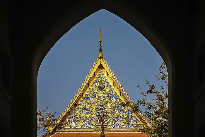 Framed Print : Ornate golden triangular roof of a Buddhist temple in Bangkok
