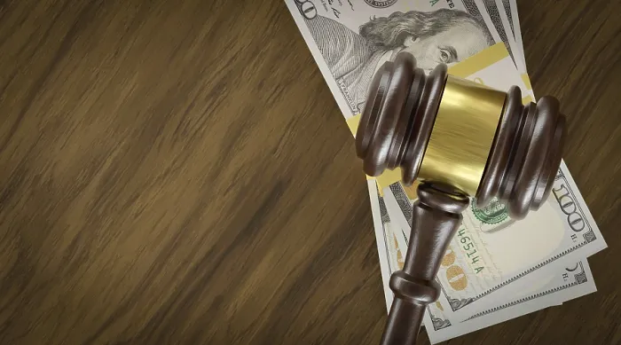 Framed Print : Overhead of gavel resting on a table and stacks of thousands of dollars with room for text Framed Print : Overhead of gavel resting on a table and stacks of thousands of dollars with room for text