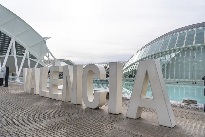 Framed Print : Oversized white valencia lettering on a modern promenade with the city of arts
