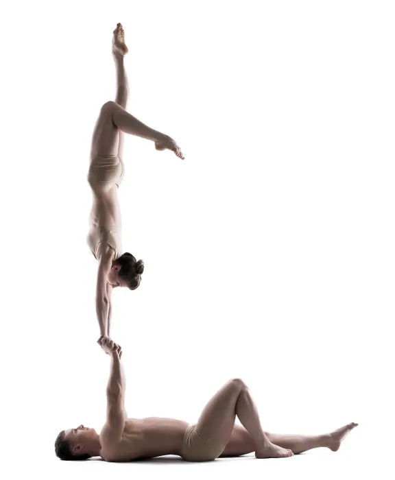 Framed Print : Pair of young acrobats training in studio