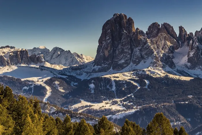 Framed Print : Panorama of the Dolomites with snow-capped peaks and conifers