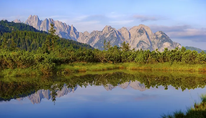 Framed Print : Panorama photo, the peaks of the Gosaukamm are reflected in the moor lake at Loeckermoos