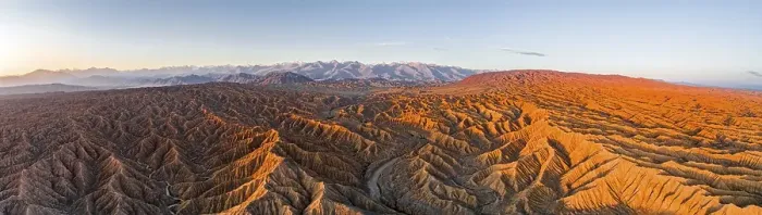 Framed Print : Panorama, riverbed runs through a landscape of eroded hills
