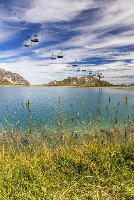 Framed Print : The panoramic lake on Saloberkopf with cable car and mountains in the background under a blue sky Framed Print : The panoramic lake on Saloberkopf with cable car and mountains in the background under a blue sky
