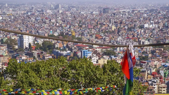 Framed Print : Panoramic view of buildings with colorful prayer flags in the foreground and mountains in the distance Framed Print : Panoramic view of buildings with colorful prayer flags in the foreground and mountains in the distance