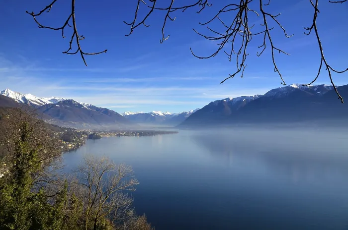 Framed Print : Panoramic View over Lake Maggiore with Snowcapped Mountain in a Misty Morning and in a Sunny Day in Ascona Framed Print : Panoramic View over Lake Maggiore with Snowcapped Mountain in a Misty Morning and in a Sunny Day in Ascona
