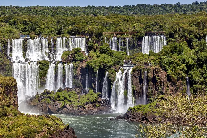 Framed Print : Panoramic view of lush waterfalls amidst dense vegetation