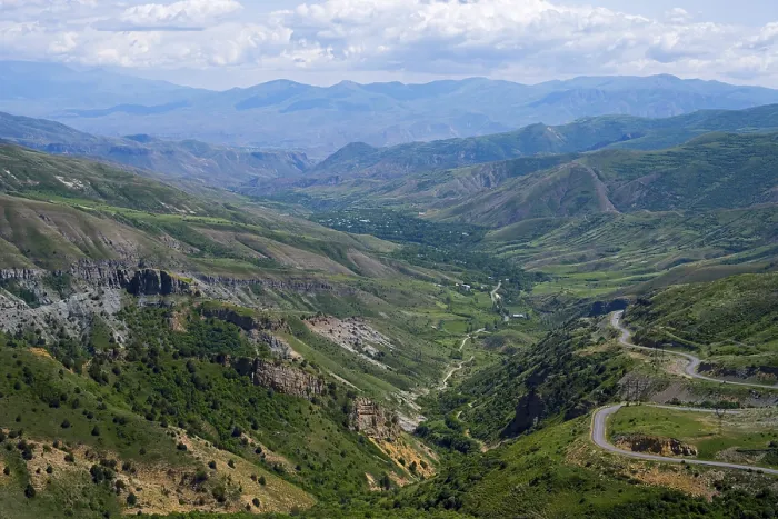 Framed Print : Panoramic view of mountains, green landscape with winding roads