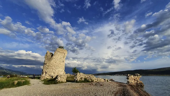 Framed Print : Panoramic view of a ruin on the waterfront in a cloudy blue sky Framed Print : Panoramic view of a ruin on the waterfront in a cloudy blue sky