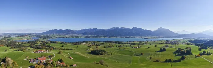 Framed Print : Panoramic view of a vast landscape with Lake Forggensee and mountains on the horizon Framed Print : Panoramic view of a vast landscape with Lake Forggensee and mountains on the horizon