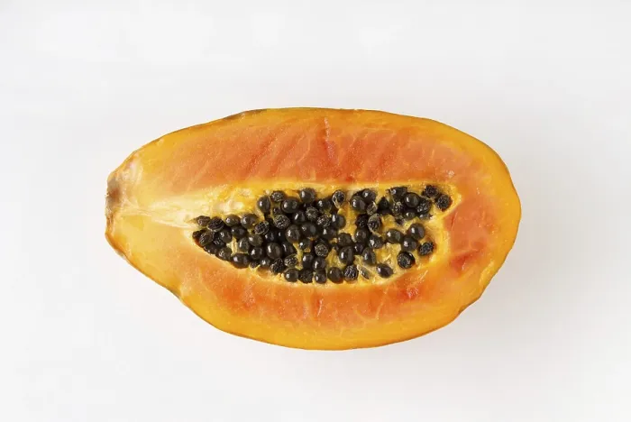 Framed Print : Papaya on a white background, close-up, flat lay