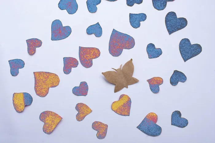 Framed Print : Paper butterfly and paper hearts in red color
