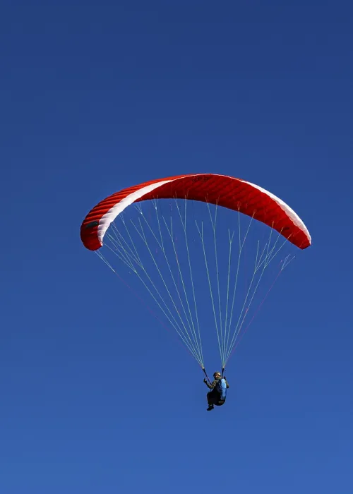 Framed Print : Paragliders against a blue sky