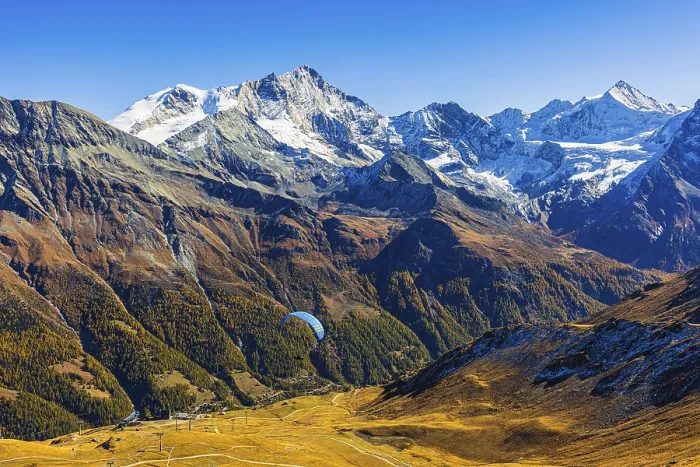 Framed Print : Paragliders flying against the backdrop of the Valais Alps