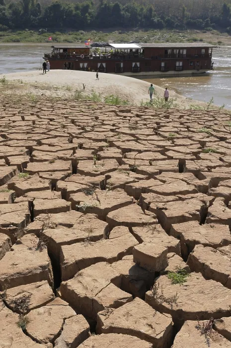 Framed Print : Parched, dry earth crust on the banks of the Mekong