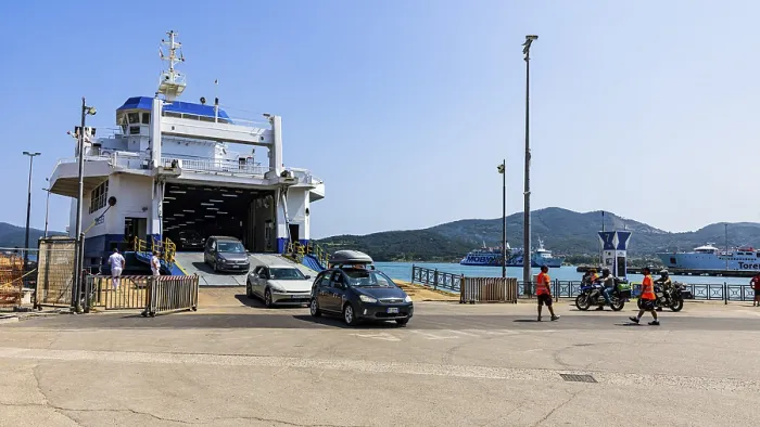 Framed Print : Passenger cars leaving the ferry in the harbour of Portoferraio